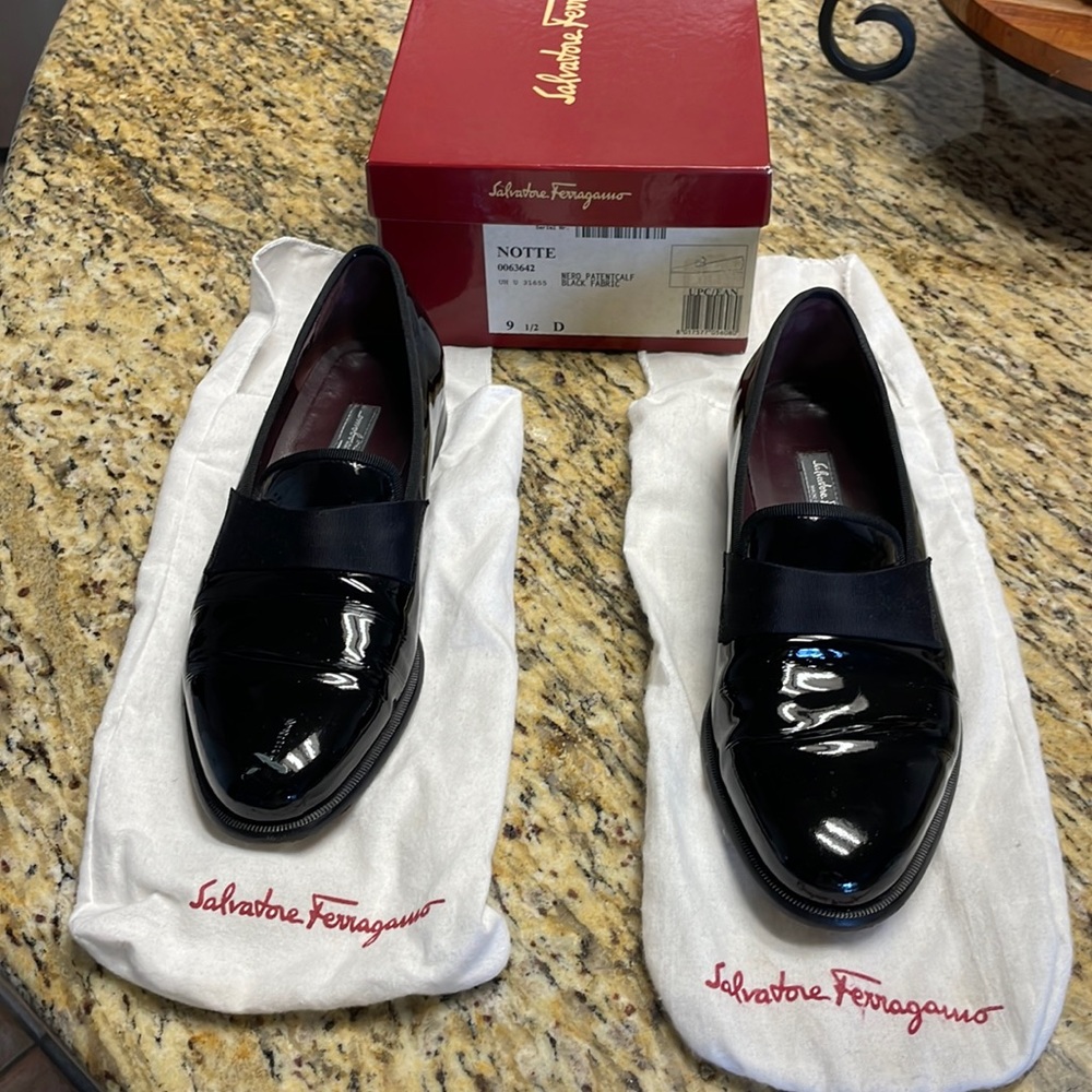 Glam SF Black Patent shoes. Used twice. Has a cut on Right top shoe. No returns.